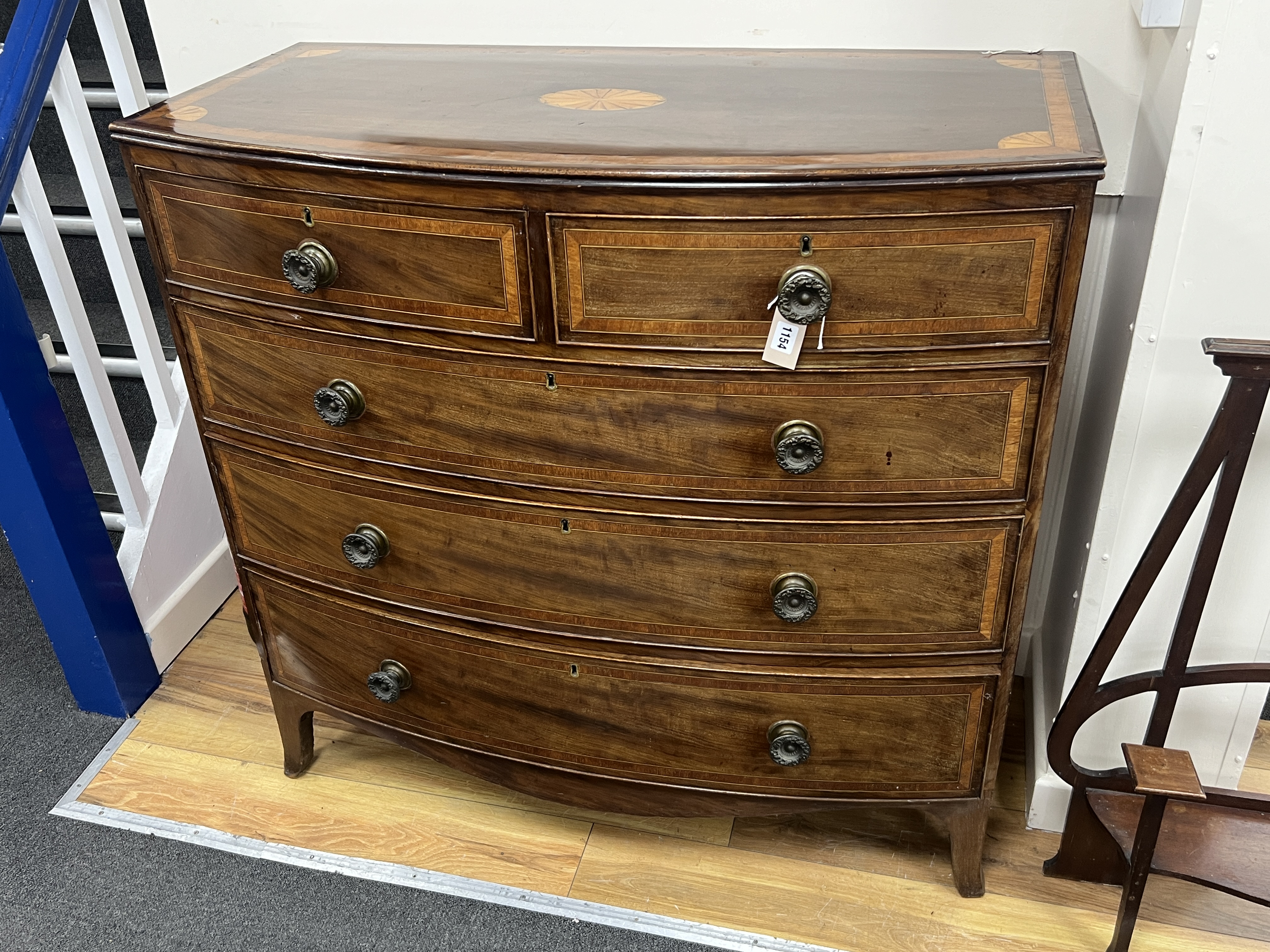 A Regency inlaid mahogany bow front chest, width 108cm, depth 52cm, height 104cm